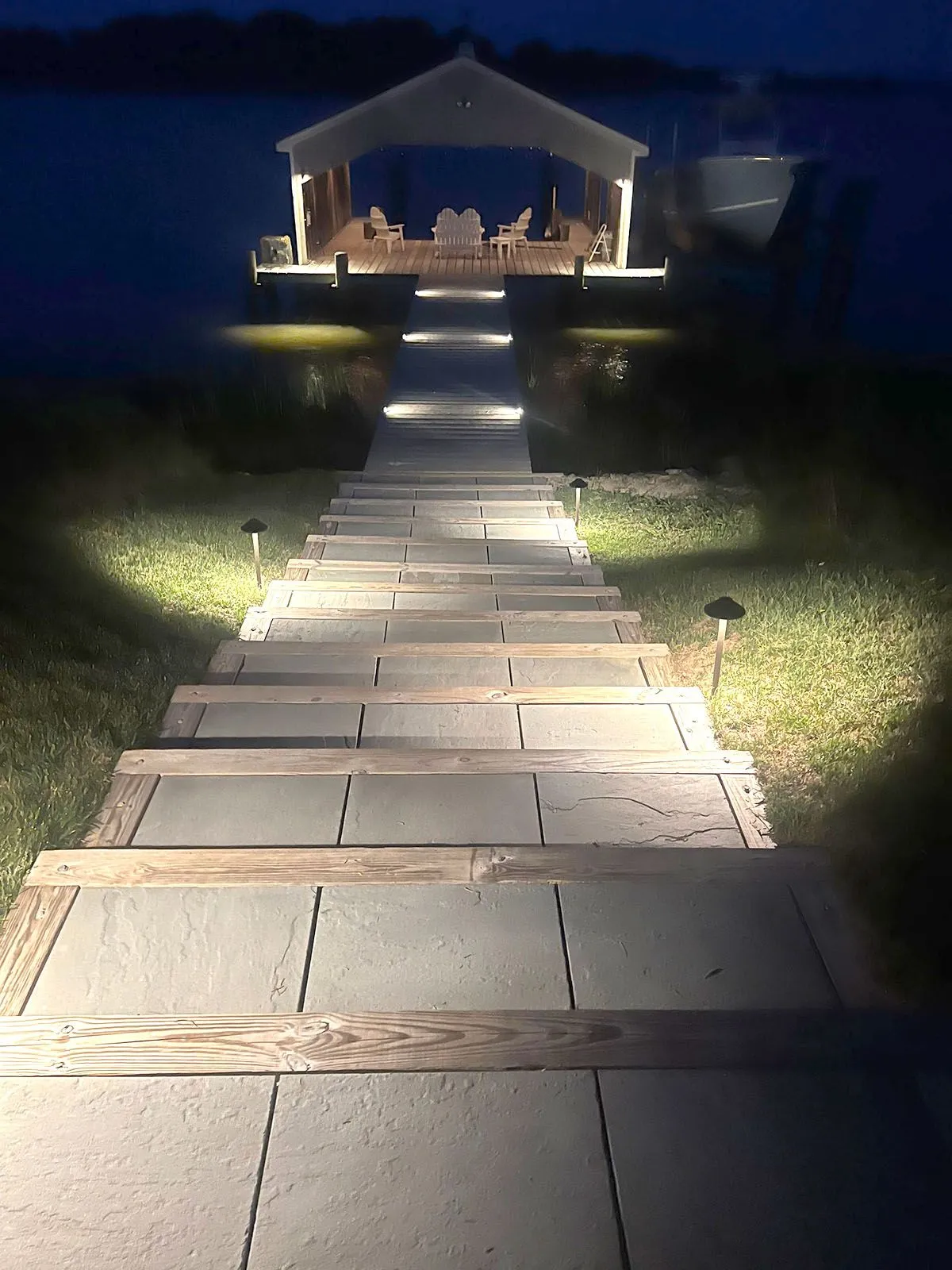 A well-lighted staircase leading to a gazebo