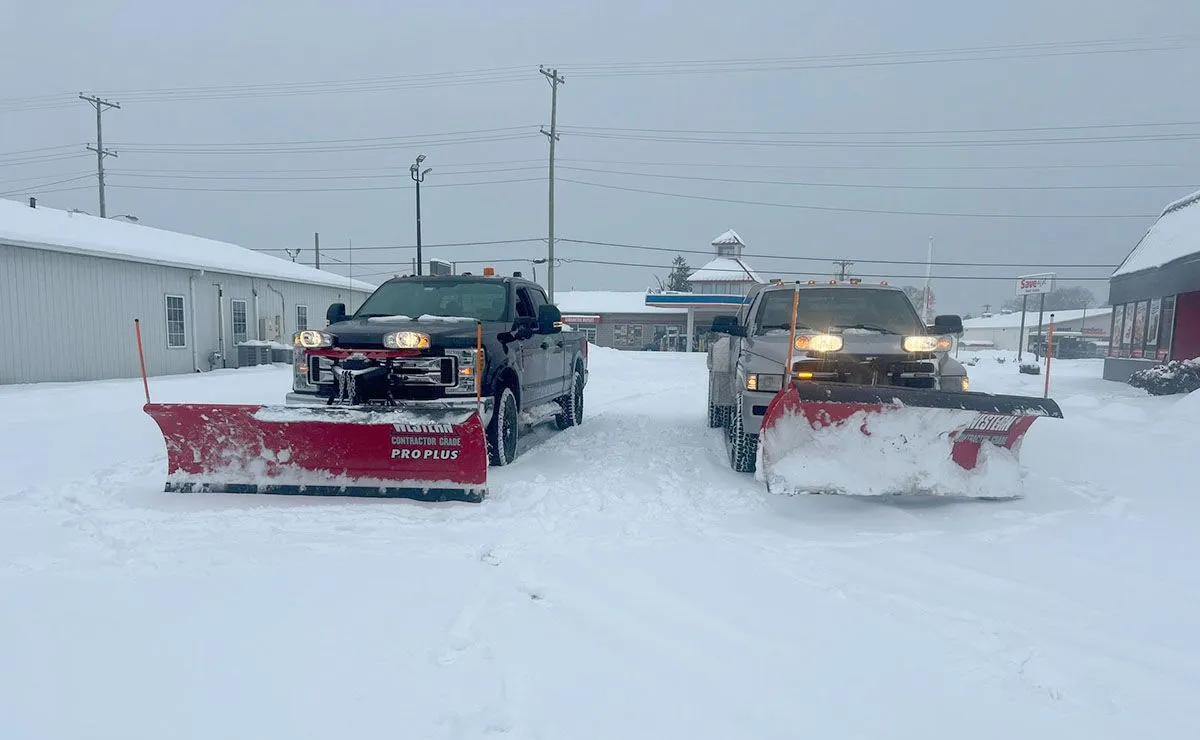 Two snow plowing trucks