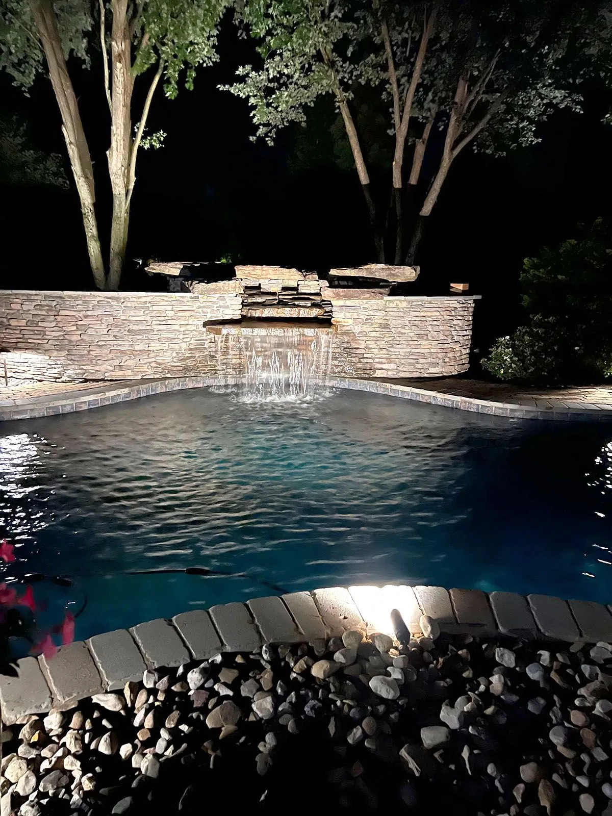 A well-lighted swimming pool at night